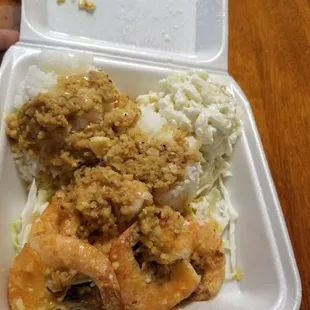 a styrofoam container of food