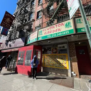 a woman walking past a restaurant