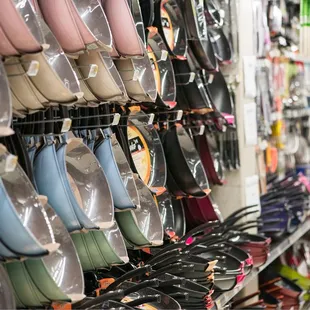 rows of shoes in a store