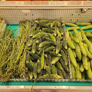 a display of cucumbers and beans