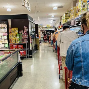 Standing at the right hand corner of store