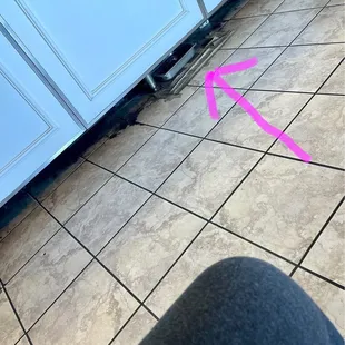 Used frying oil under fryer near front ? Floors need cleaning.