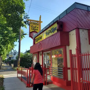 a woman walking down the sidewalk