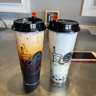 On the left, banana colada smoothie with boba.
