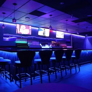 a bar with purple lighting