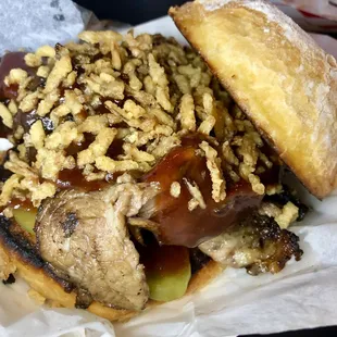 BBQ beyond driven sandwich - brisket, pickles, bat outta hell sauce, and fried onions