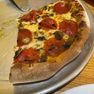 a slice taken out of a pizza