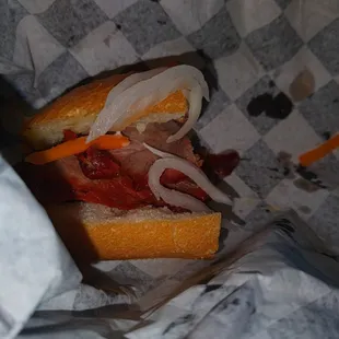 a sandwich with onions and meat