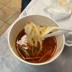 a bowl of soup with noodles