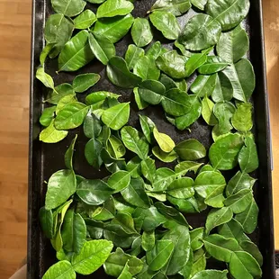 Kaffir lime leaves.  I only needed 5 for my soup recipe, but the smallest bag held this many!  Please package smaller amounts for home cooks