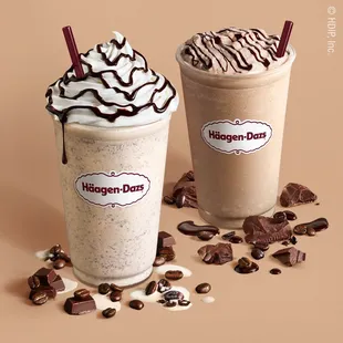 two drinks with chocolate and whipped cream