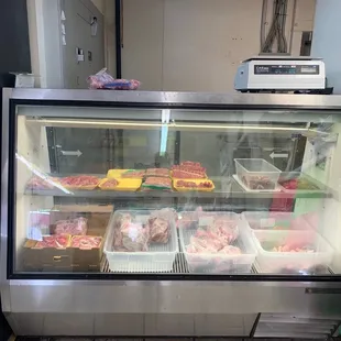 a display case with various foods