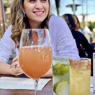 Left to right: guava Bellini, mojito, mezcal cocktail