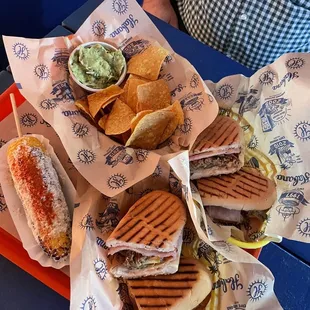 Corn, Cuban sandwich, chips and quac