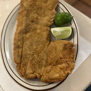 a plate of fried fish