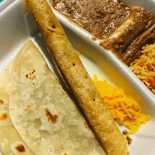 a tortilla, rice, and beans