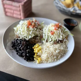 Barbacoa tostadas with black beans, corn, &amp; rice