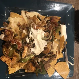 These are the nachos with chicken, shrimp, and steak.