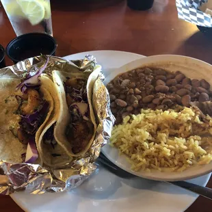 Baha (shrimp) tacos with rice and beans with bacon &amp; chorizo. Can't remember the name of them.