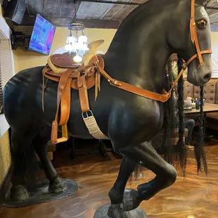 Life size horse statue at front door.