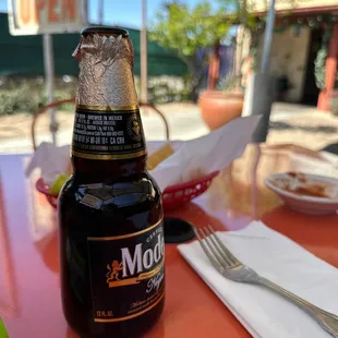 a bottle of beer on a table