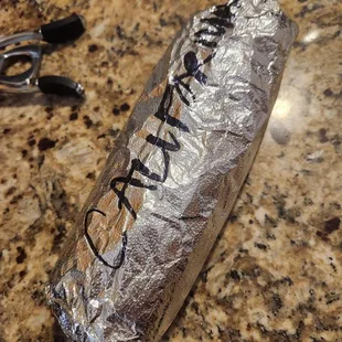 a burrito wrapped in foil