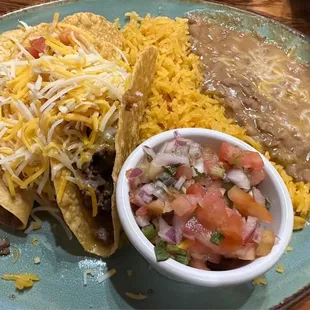 Ground beef tacos, rice and refried beans. Yum!