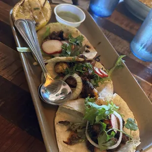 OCTOPUS TACOS  charred octopus, salsa albanil, saisa macha, radish