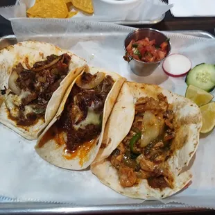 Street Tacos entree with Steak, Chicken, and Chorizo