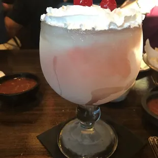 a margarita with a cherry on top