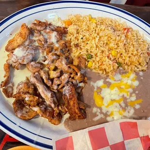 POLLO A LA CREMA Grilled chicken tenders with our special sauce, served with rice and beans