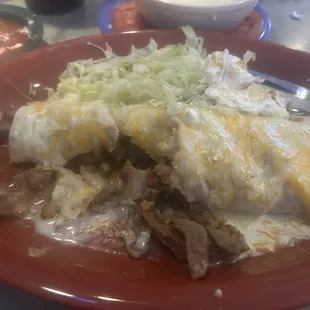 Supper Burrito with lettuce and sour cream