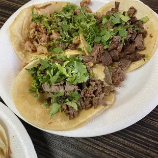 Tacos de lengua, carne asada, pollo asada with cilantro. All very tender and well cooked.
