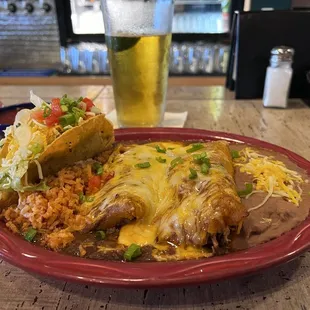 Two enchiladas and a taco go well with the cold beer.