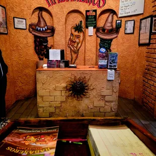  a man standing in front of a mexican restaurant