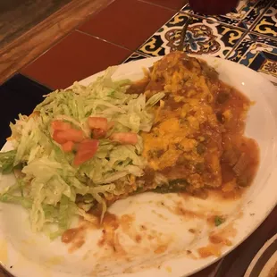 a plate of enchiladas and a salad
