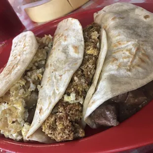 Potato and eggs, chorizo and eggs, a carne guisada taco. These tacos are FANTASTIC!