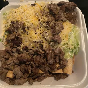 Rolled Tacos topped with carne asada!