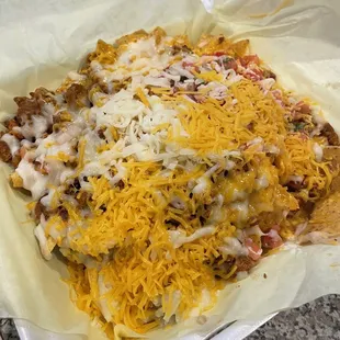 Raw cheese thrown on our nachos. It&apos;s the 2nd time they do that.