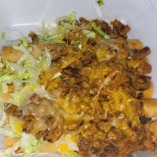 Rolled tacos with pastor on top