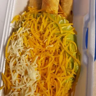 3 rolled tacos with guacamole