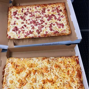 three pizzas in boxes