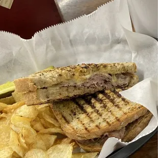 Deli sandwich and chips.