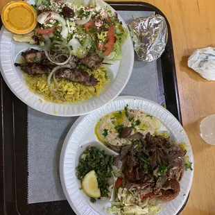 two plates of food on a tray