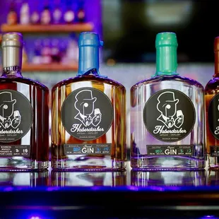 three bottles of gin