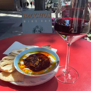 Outdoor table with wine and appetizer