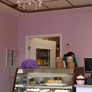 a bakery with a chandelier in the background