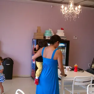 a woman and a child in a bakery