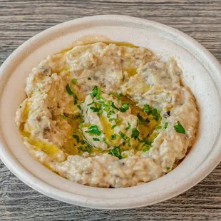 a bowl of hummusle
