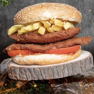 a hamburger on a tree stump